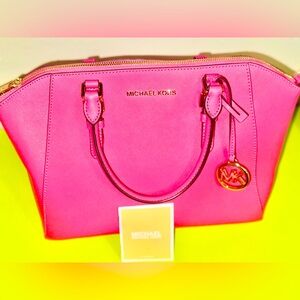 Michael Kors Bag with a sling. It's a beautiful Brand new Pink purse.